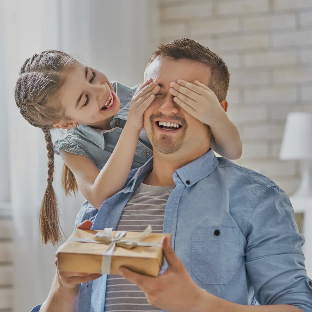 Daughter surprising her dad with a thoughtful personalized gift